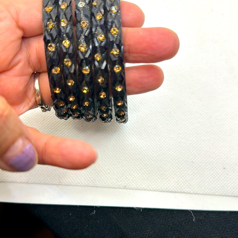 Back metal bracelets with shiny stones.